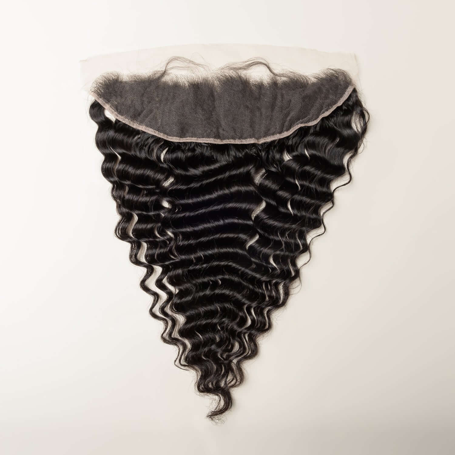 Black hair extensions with a lace front on a white background
