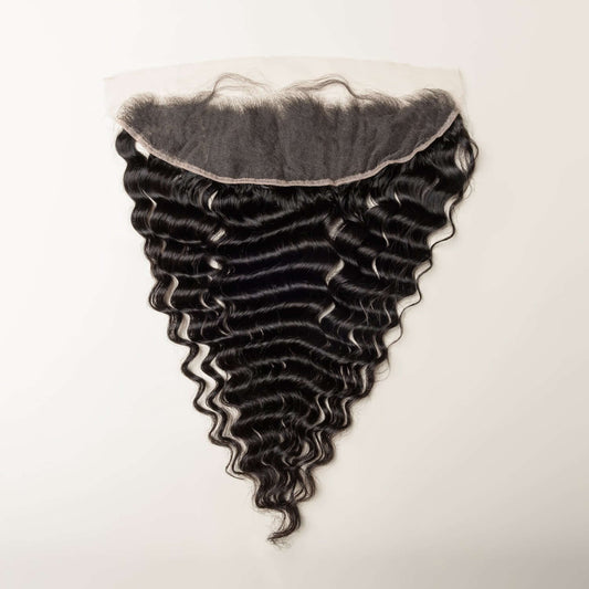 Black hair extensions with a lace front on a white background